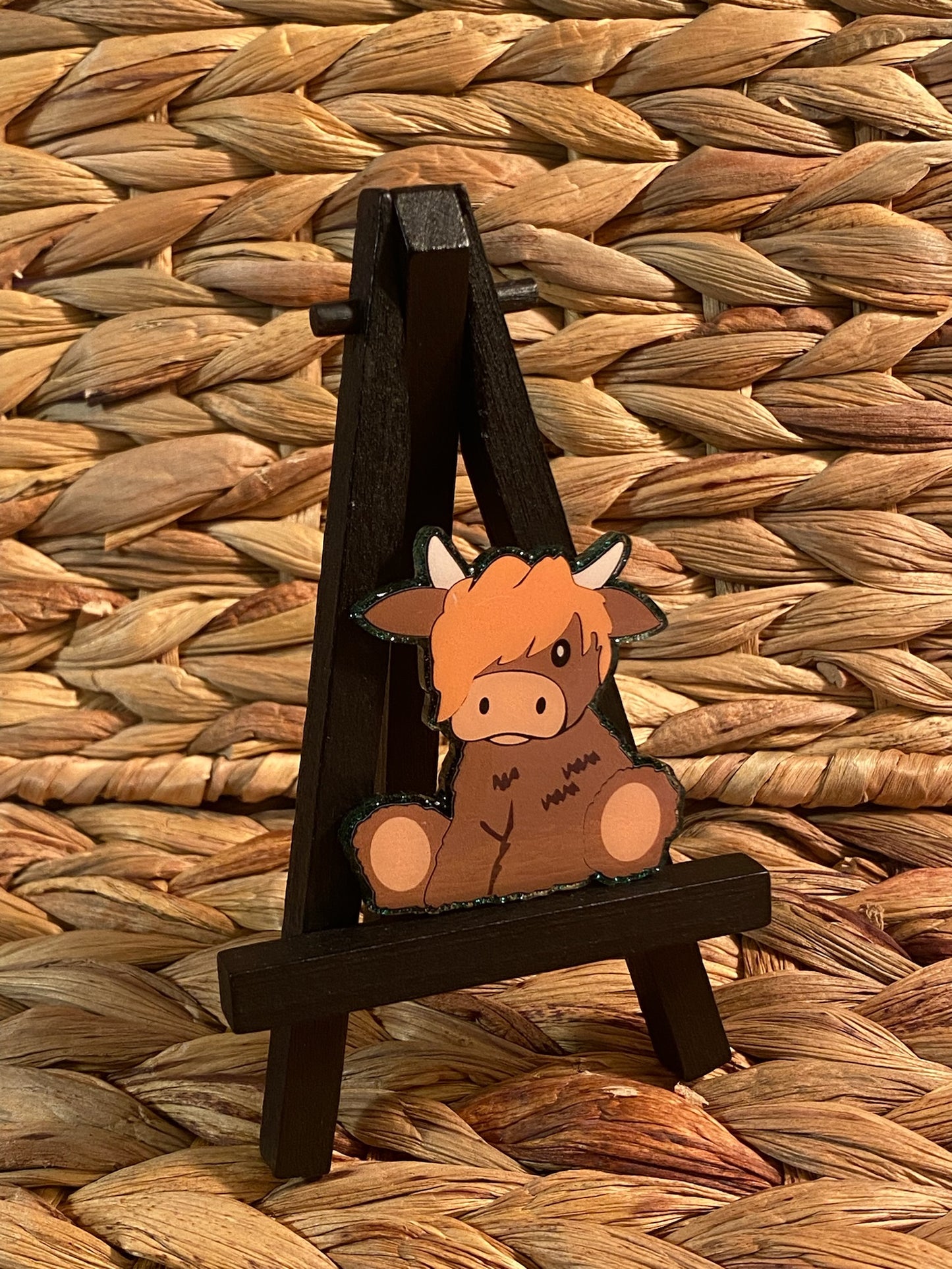 Sitting Highland Cow